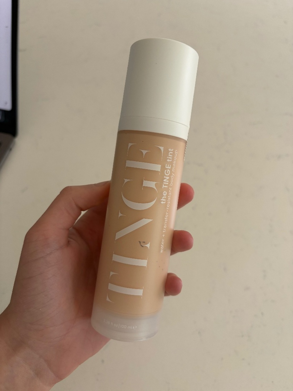 The Tinge Tint body makeup fair neutral with brush